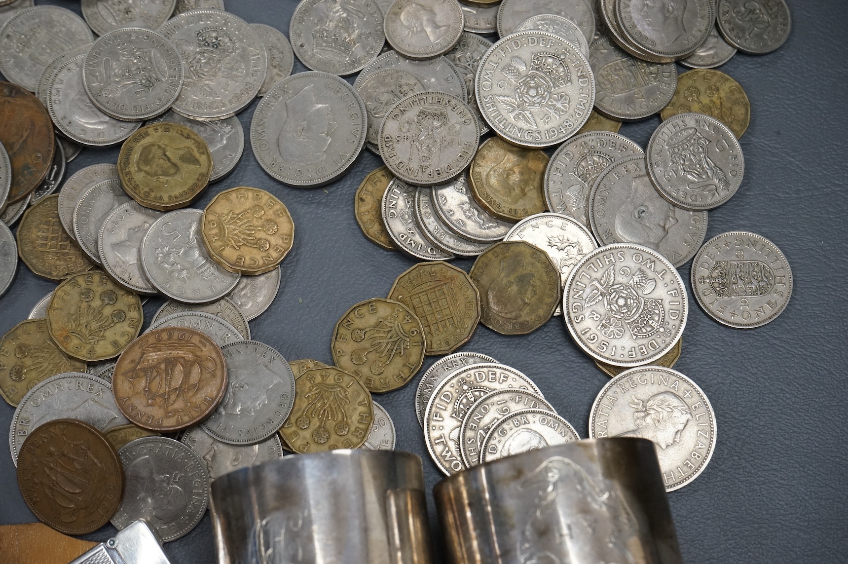 Sundry items comprising a cased Dunhill lighter, coins and napkin rings